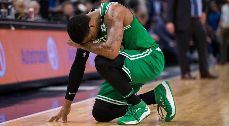 Marcus Smart prays after Celtics teammate Jaylen Brown suffered a nasty fall. Marcus Smart prays after Jaylen Brown's fall.
